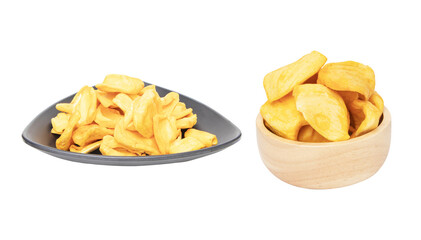 Dried Butter Roasted Jackfruit isolated on cut out PNG or transparent background. Pile of dried jackfruit in wooden and on black plate shape cup for snack chips. Food preservation popular in Thailand.