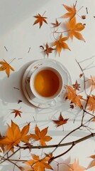 A cup of tea with autumn leaves around. Creative flat lay photo with soft white background.