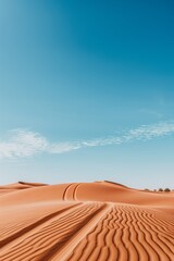 Naklejka premium Landscape overlooking the sandy desert. Natural background with copy space. Minimalistic landscape with sand dune