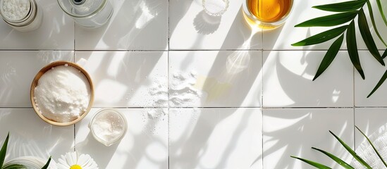 Top view of white tiled table with vinegar baking soda and copy space image