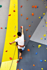 Athletes training on climbing wall