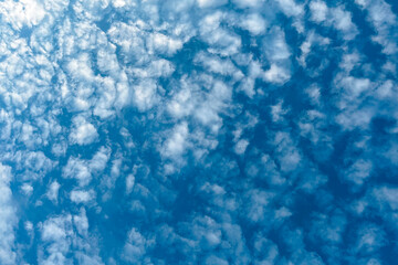 Sky background with clouds. Beauty of white clouds on blue sky with soft sunlight, nature view
