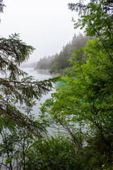Foggy morning at the lake. Lake Eibsee and Zugspitze Mountain, Germany, Europe