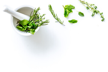 Alternative medicine with medicinal herbs on white background to