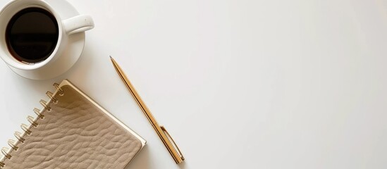 Minimalist office workspace featuring a top view of a notepad beige leather personal diary clean sheets gold pen coffee cup on a white desk ideal for educational or professional purposes with the add