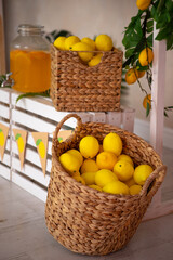 a basket of lemons and lemons with a banner that says lemonade