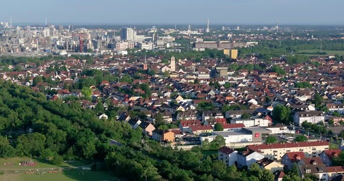 Drone pan over the German industrial city of Ludwigshafen with a large chemical plant during the day