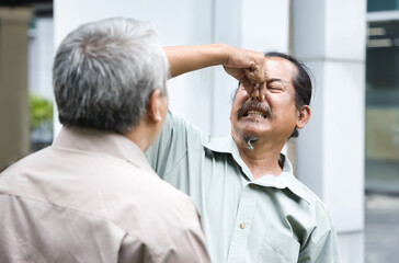 Old Asian man having poor oral health and stinking rotten bad breath, unpleasant smelly dirty...