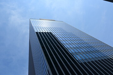 Obraz premium Skyscraper, mirrored windows, reflecting a building.