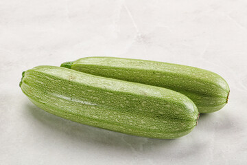 Raw green ripe zucchini vegetable
