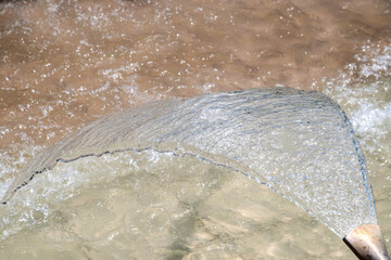Water fountain in park, close-up of water splashing as water background