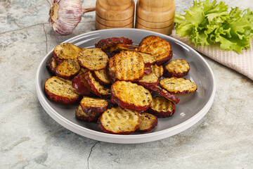 Baked red batat slices with herbs