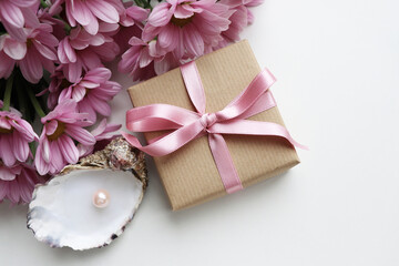 greeting card layout. bouquet of pink chrysanthemum flowers and gift box