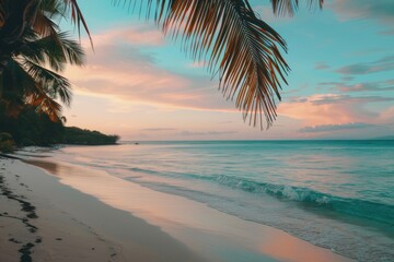 A tranquil beach scene during sunset featuring calming waves gently washing ashore and towering palm trees creating a picturesque and peaceful coastal ambiance.