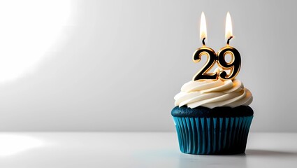 Gold Candle Number 29 on Blue Cupcake with Gray Background

