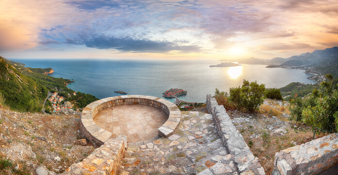 Captivating sunset view of Adriatic coast and islet Sveti Stefan from church st. Sava viewpoint near Budwa