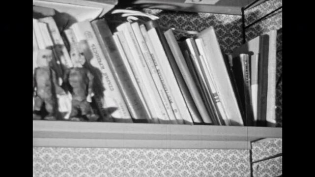 Film archive, funny figure men plasticine animation. Black white stop motion animated hilarious toy in comedy cartoon. Realistic character in room interior explore world. Vintage retro travel 1980s