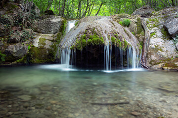 Fototapeta premium Waterfalls and rapids on the Ulu-Uzen River in the Crimean Mountains