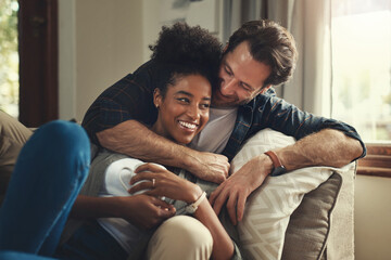 Home, happy and couple with hug on sofa for weekend romance, partnership and bonding together. Man,...