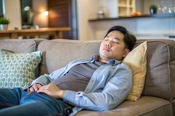 Asian man take a nap on sofa with snore take nap daydreaming in living rooms snoring Healthcare medical Sleep health man sleep at home Dream rest tired father dad day Sleep Apnea Sdb resting at