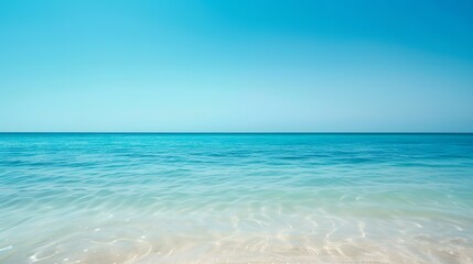 Obraz premium Tranquil Aquamarine Ocean Water and Clear Blue Sky