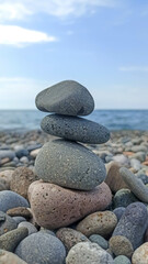 Balance pebble stones on the beach near the sea