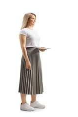 Young woman holding an empty plate