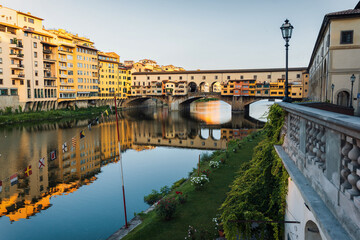 Summer morning in Florence. Ponto Vecchio and the historic center. People go jogging at dawn and there are no tourists.