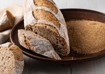 Buckwheat baguette and buckwheat flour in a bowl