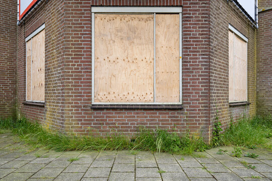 windows of a building protected with wooden panels