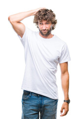Obraz premium Handsome hispanic model man over isolated background confuse and wonder about question. Uncertain with doubt, thinking with hand on head. Pensive concept.