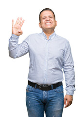 Middle age arab business man over isolated background showing and pointing up with fingers number four while smiling confident and happy.