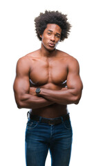 Fototapeta premium Afro american shirtless man showing nude body over isolated background skeptic and nervous, disapproving expression on face with crossed arms. Negative person.