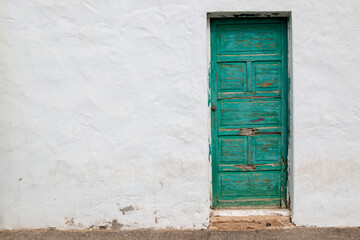 Green old wooden door, La Graciosa, Spain