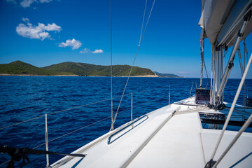Fototapeta premium Yacht sailing near Croatia coast. Close-up view of the deck, mast and sails. Yachting concept