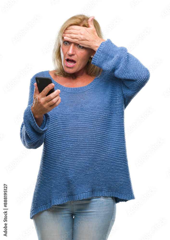 Canvas Prints Middle age blonde woman sending message using smartphone over isolated background stressed with hand on head, shocked with shame and surprise face, angry and frustrated. Fear and upset for mistake.