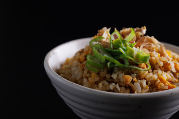 Japanese fried rice yakimeshi isolated in black background