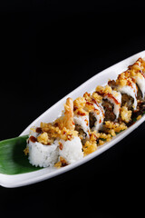 Shrimp Tempura Roll japanese food isolate in black background