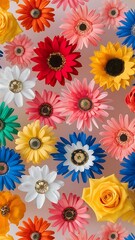 Colorful artificial flowers as background top view flower pattern