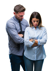 Young workers business couple over isolated background skeptic and nervous, disapproving expression on face with crossed arms. Negative person.