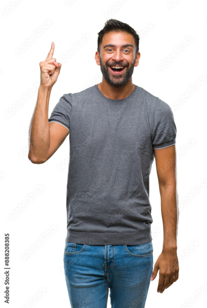 Sticker Adult hispanic man over isolated background pointing finger up with successful idea. Exited and happy. Number one.