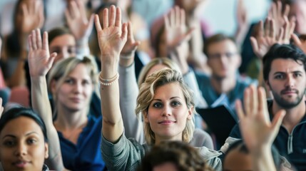 Fototapeta premium active participation at a conference or seminar, where attendees are raising their hands, likely to ask questions or vote on a discussion point.