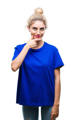 Young beautiful blonde and blue eyes woman wearing blue t-shirt over isolated background looking confident at the camera with smile with crossed arms and hand raised on chin. Thinking positive.