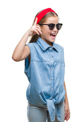 Young beautiful girl wearing sunglasses over isolated background pointing finger up with successful idea. Exited and happy. Number one.