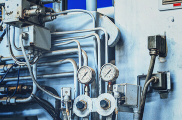 Manometer on industrial equipment. Large industrial equipment at the plant, pressure in the pipes