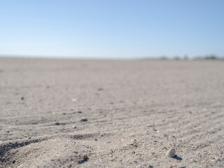 Empty closeup of sand at Short Beach in Stratford Connecticut during the day. 