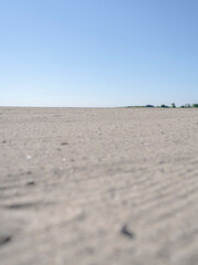Empty closeup of sand at Short Beach in Stratford Connecticut during the day. 
