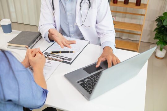 A young woman sought medical advice after becoming ill and had the doctor examine her body and give advice on health care and prescribe medication to treat her symptoms. medical consultant concept