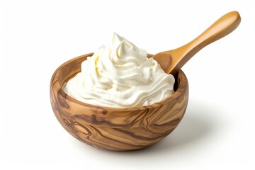 Wooden bowl and spoon filled with sour cream mayonnaise and yogurt photographed on a white background with a full depth of field providing a clipping path