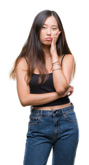 Fototapeta premium Young asian woman over isolated background thinking looking tired and bored with depression problems with crossed arms.